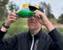 A participant of the Watershed Matters program looks closely at a two-way bug viewer.