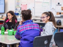 Students gathered around a table in class