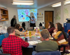 Group of people participate in a workshop inside a conference room