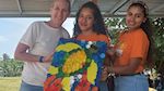 A group photo featuring CEE-Change Fellow Holly Hummel and two members from the Bebe Crecer Sensory Workshop: Reusing plastic waste to make art at the Brazadas For the Ocean event