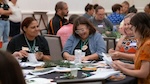 Four educators doing an environmental education activity at a PLT Training. Photo credit: PLT 